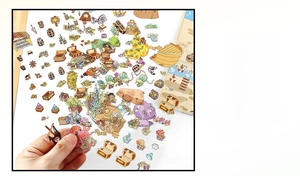 Close-up of ocean treasure PET stickers showing octopus, gold chest and ship illustrations