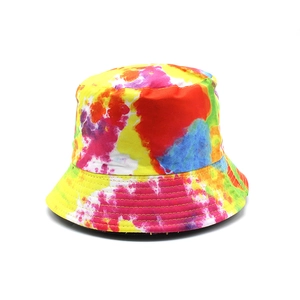 Close-up of vibrant tie-dye bucket hat with reinforced stitching on cotton brim