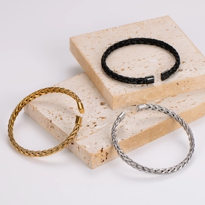 Handcrafted minimalist braided twisted bangle set in gold, silver, and black metal finishes