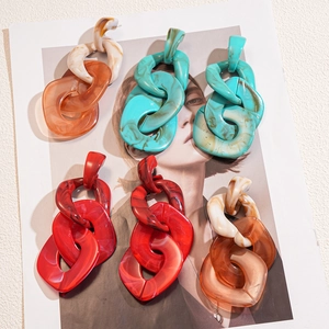 Exaggerated acrylic chain earrings in beige orange, turquoise green and red colors