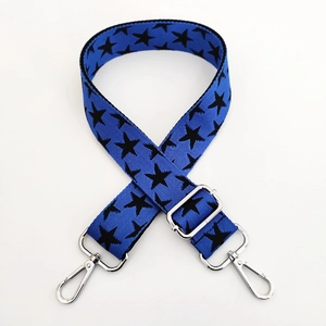 Close-up of blue star pattern adjustable wide shoulder strap with silver metal lobster clasps