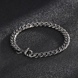 Detail of silver stainless steel Cuban link bracelet for men with secure lobster clasp
