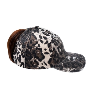 Distressed leopard print baseball cap with integrated long brown ponytail hairpiece