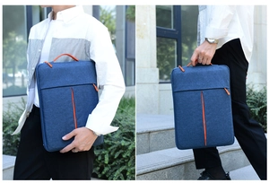 Slim laptop sleeve with navy body and orange handles shown in outdoor walking scenes