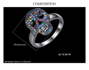 Macro shot of punk skull ring set with vibrant multi-colored zircons and black plating
