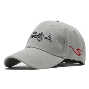 Detailed view of 3D fish bone embroidery on grey cotton twill baseball cap with curved brim