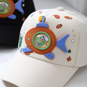Child baseball cap featuring 3D silicone orange submarine and green dinosaur patch