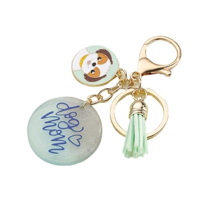 Colorful dog mom tassel keychain with resin puppy charm and golden ring on white back