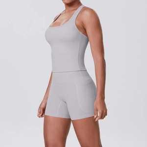 Close-up of lilac yoga set showing side pockets on high-waisted fitness shorts