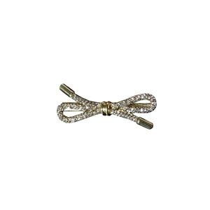 Elegant gold bow hair clip with sparkling rhinestones on a clean white background