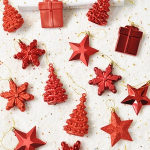 Festive red Christmas tree ornaments set with star and snowflake shapes in gold finish
