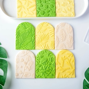 Leaf pattern fondant stamps for cake decorating with floral relief textures in green and yellow