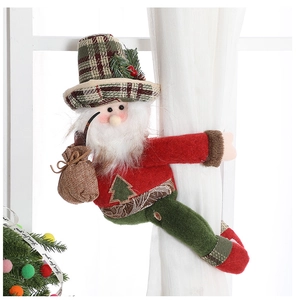 Detail of Santa Claus curtain tieback featuring festive plaid fabric and plush textures