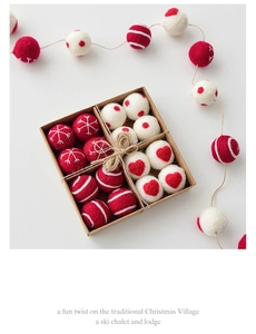 Close-up of red and white wool felt Christmas ornaments in a kraft paper gift box