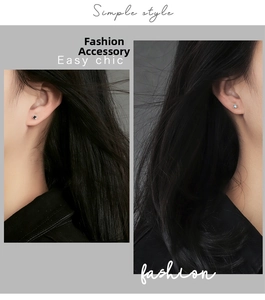 Detailed close-up of square zircon stud earrings in black and light blue on model ear
