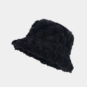 Detailed close-up showing the thick pineapple texture and plush black faux rabbit fur fabric