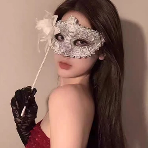Lace masquerade mask with silk flower and matching long fingerless gloves on a model