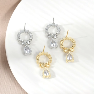 Elegant water drop earrings with bow and sparkling zircon in gold and silver finish