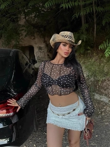 Women's black mesh long sleeve crop top with white polka dot pattern and ruffled edges