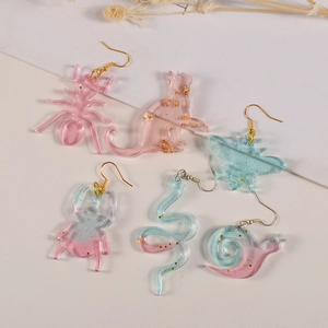 Creative resin animal earrings set featuring insects and cats with gold foil accents