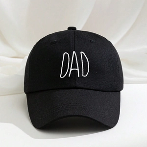 Close-up of black cotton baseball cap with premium white MOM and DAD embroidery detail