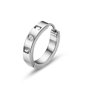 Close-up of silver stainless steel hoop earrings with three square inlaid diamonds