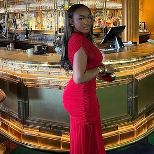 Elegant red sleeveless bodycon maxi dress with ruching detail and high neckline