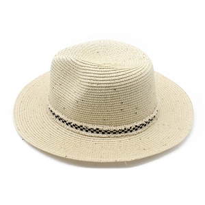 Detailed view of summer straw boater hat with black and white checkered ribbon trim