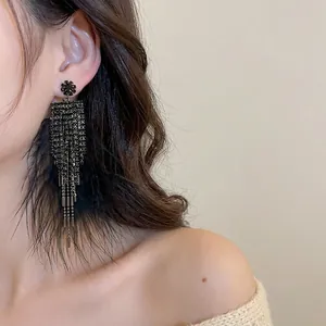 Boucles d'oreilles élégantes plumes noires avec strass et motif fleur pour femme