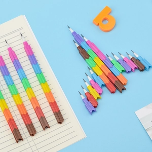 Rainbow building block pencils for students with colorful stackable nibs on blue background