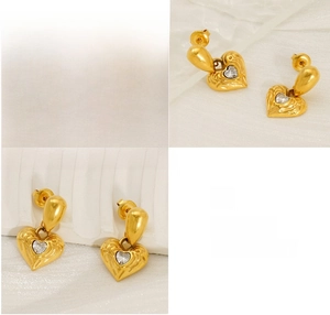 Detailed view of 18k gold plated heart earrings showing polishing and plating quality