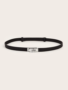 Detailed view of black slim leather belt with silver rotating lock on white background