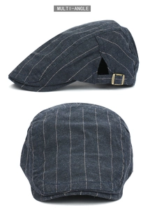 Detail view of cotton striped flat cap with adjustable bronze buckle and vintage style