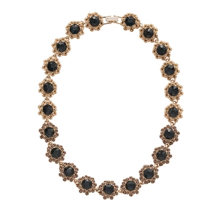 Vintage gold necklace with black crystal floral pendants in a classic retro luxury style
