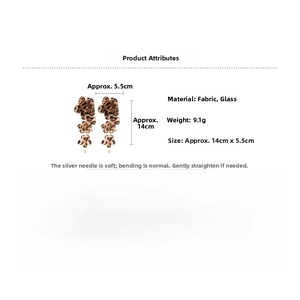 Detail view of leopard print flower earrings with size dimensions 14cm by 5.5cm