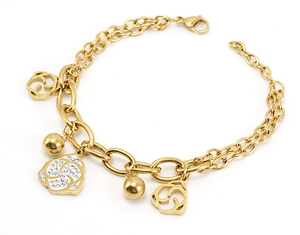 Detail of gold double-layer bracelet featuring rose charms and crystal accents