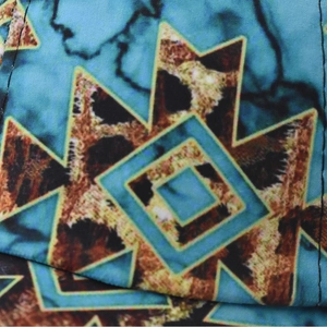 Women's ponytail baseball cap featuring geometric leopard print and turquoise pattern