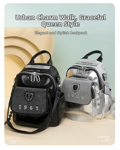 Close-up of rhinestone detailing and shield emblem on black and silver mini backpacks