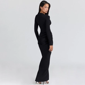 Detail of elegant black long-sleeved evening dress with waist ruching and side silhouette
