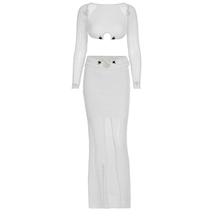 Detail of white sequin long-sleeve crop top and maxi skirt set with button accents