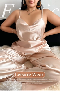 Detail of champagne gold satin loungewear set featuring luxury glossy silk-like fabric texture