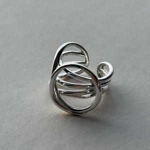 Detail of S925 sterling silver ring featuring multi-layer wrap design and geometric circle