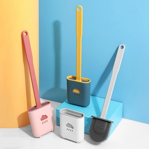 Cloud-shaped silicone toilet brush with wall-mounted base in pink, green, and white