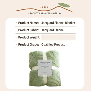 Light green flannel jacquard blanket folded with elegant ribbon and product tag