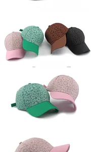 Detail view of floral jacquard baseball caps in pink, green, brown and black colors