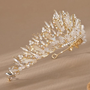 Detailed side view of a gold bridal crown featuring marquise and teardrop crystals