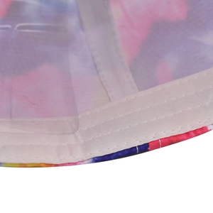 Detail of cotton baseball cap interior featuring tie-dye pattern and sweatband stitching
