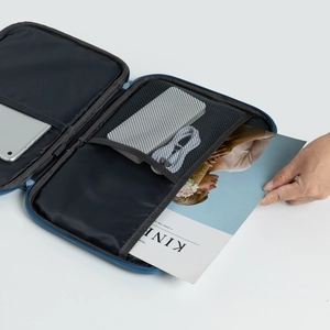 Internal layout of dark blue shockproof tablet bag with mesh pockets and elastic straps