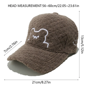 Detail view of brown plush baseball cap showing dimensions and bear embroidery