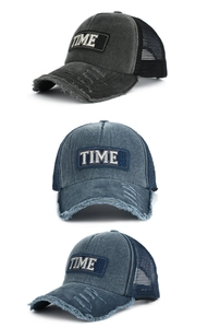 Detail of vintage washed cotton trucker hats with 1966 patches and mesh back